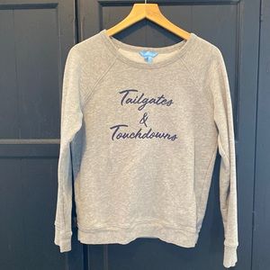 Women’s long sleeve grey sweatshirt.